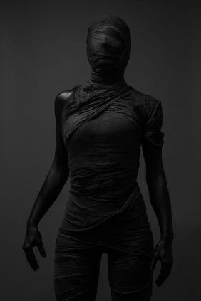 Bandaged Figure in Shadow