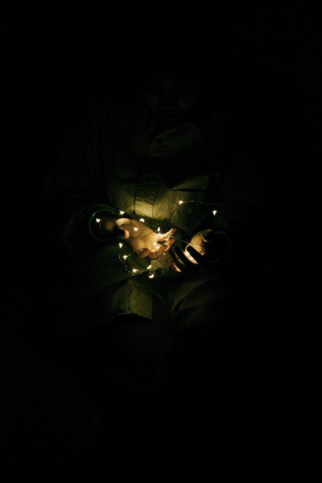 Hands Holding Fairy Lights