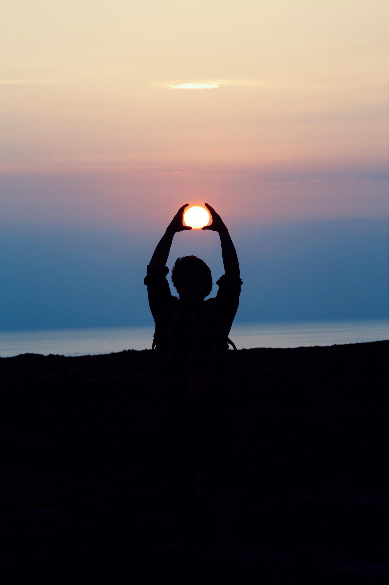 Holding the Sunset Orb