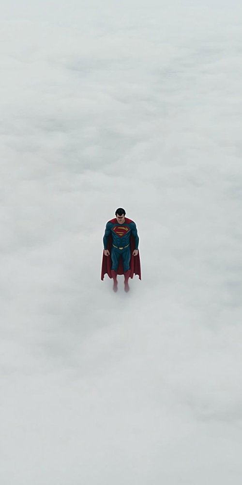 Superman_Flying_Through_Clouds