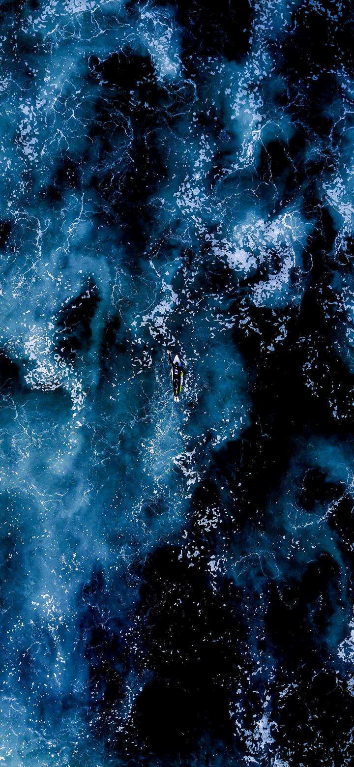 Surfer in Dark Ocean