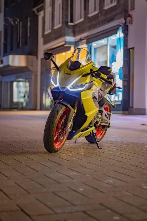 Yellow Aprilia at Night