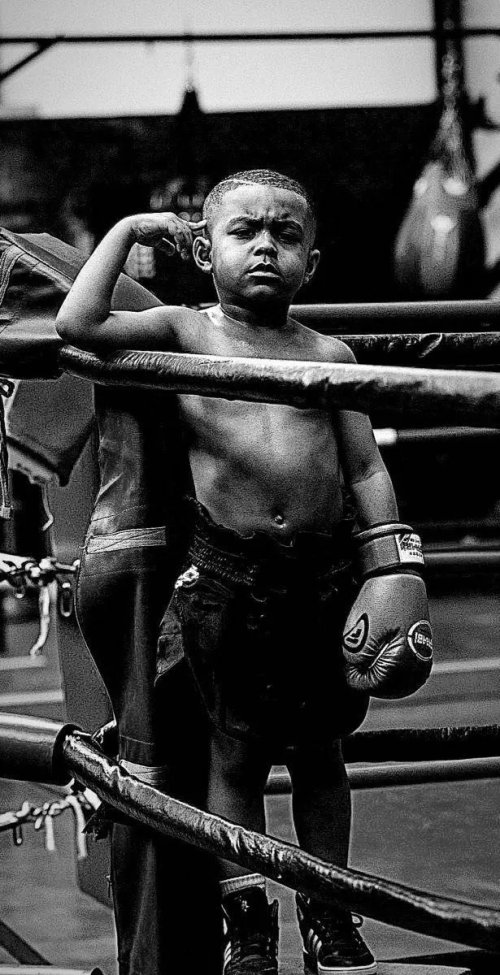 Young_Boxer_Flexing_in_Ring - Related Dark Wallpapers wallpaper