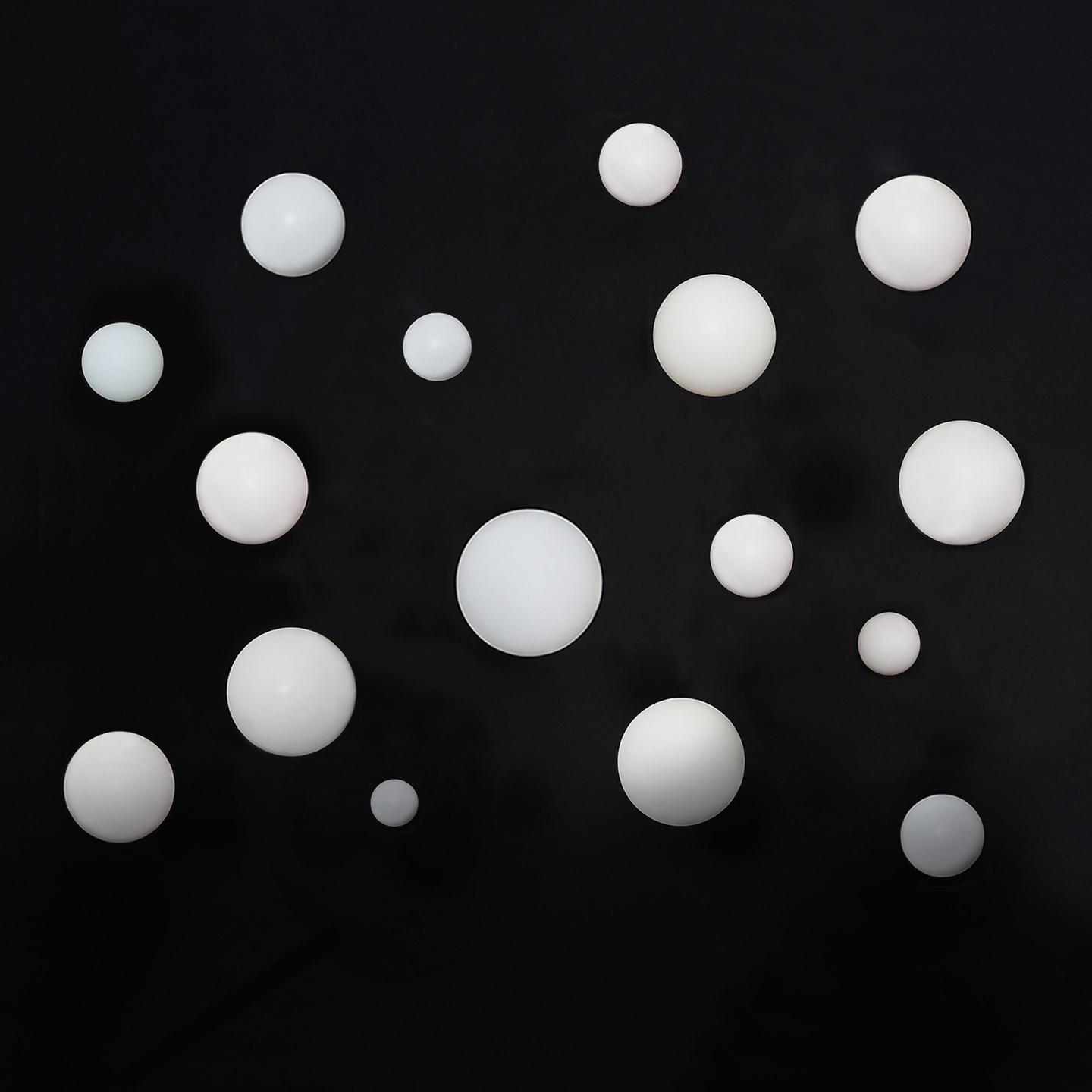White Spheres on Black